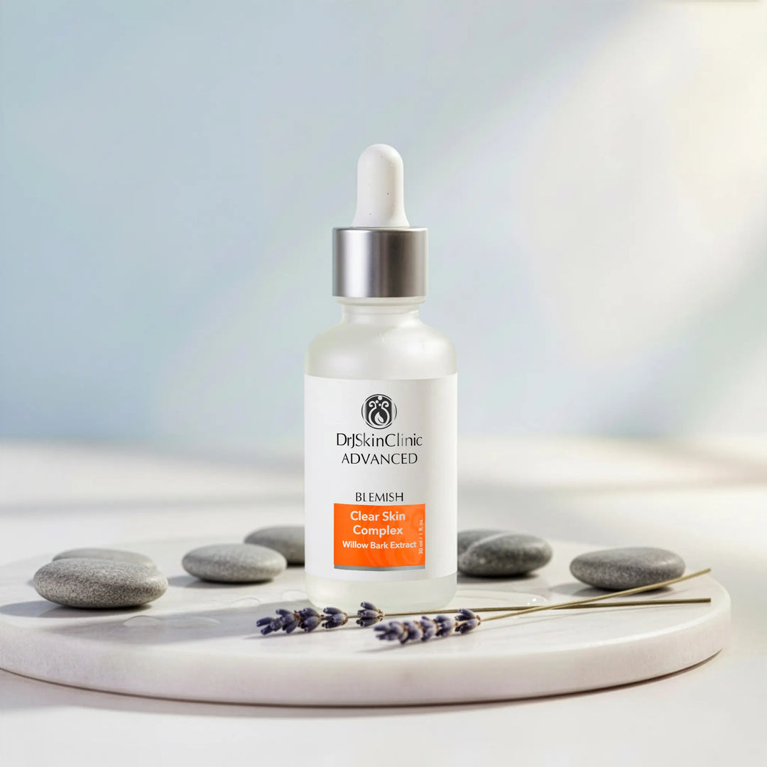 Dr. Skin Clinic Advanced skincare bottle on a white surface with stones and lavender.