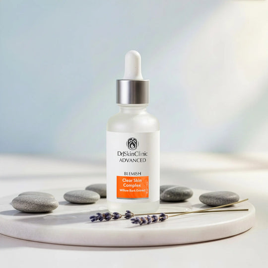 Dr. Skin Clinic Advanced skincare bottle on a white surface with stones and lavender.