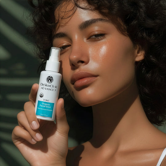 Model holding DrJSkinClinic Advanced Tone Organic Facial Elixir with Rose Geranium Complex, showcasing radiant skin and USDA Organic facial toner
