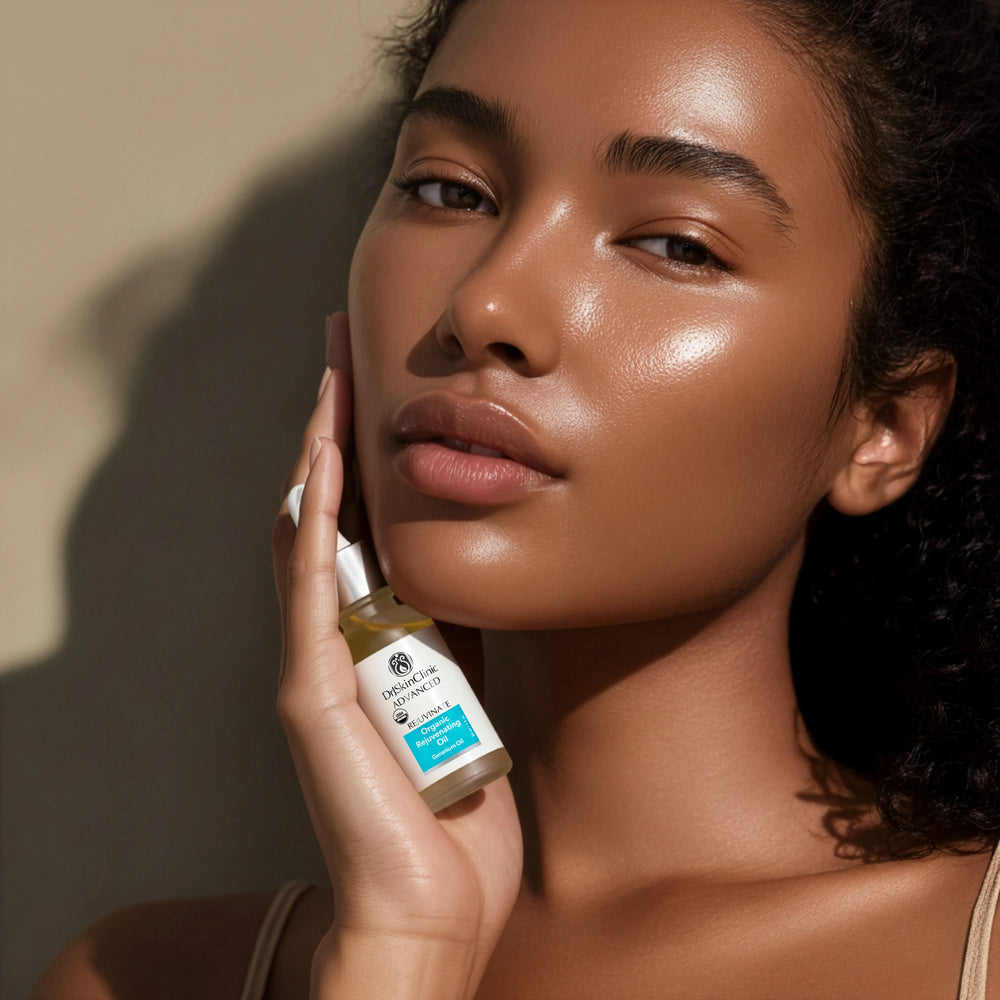Model holding DrJSkinClinic Advanced Rejuvenate Organic Rejuvenating Oil with Geranium Oil, showcasing radiant skin and USDA Organic facial oil