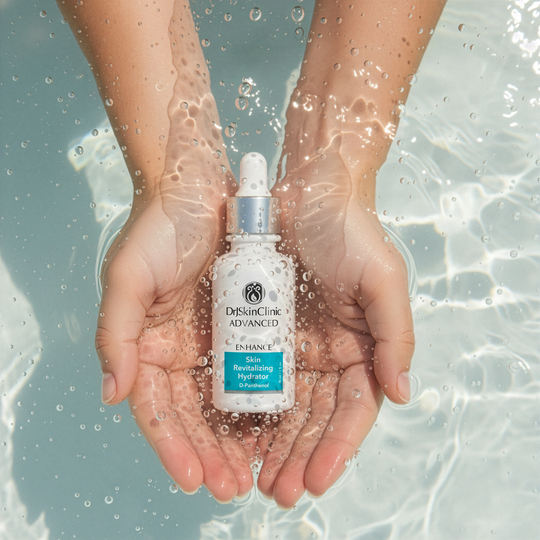 Hands holding DrSkinClinic Advanced Enhance Skin Revitalizing Hydrator submerged in water, highlighting hydration and moisture.