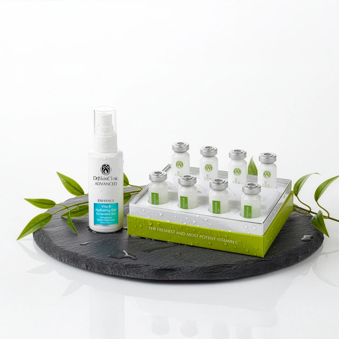 DrSkinClinic Advanced Enhance Vita-B Hydrating Gel displayed with Green C-Powder Forte vitamin C vials on a slate surface with botanical accents.